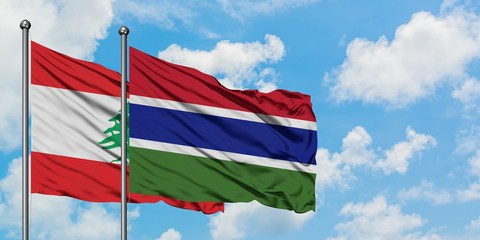 Lebanon and Gambia flag waving in the wind against white cloudy blue sky together. Diplomacy concept, international relations.