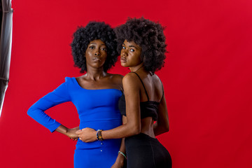 African women with afro hairstyle, tribal marks, pose for a shot