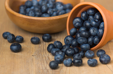 Blueberry on wooden table background. Ripe and juicy fresh picked blueberries closeup. Berries closeup