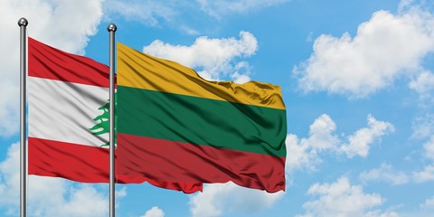 Lebanon and Lithuania flag waving in the wind against white cloudy blue sky together. Diplomacy concept, international relations.
