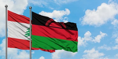 Lebanon and Malawi flag waving in the wind against white cloudy blue sky together. Diplomacy concept, international relations.