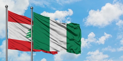 Lebanon and Nigeria flag waving in the wind against white cloudy blue sky together. Diplomacy concept, international relations.