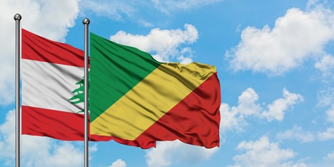 Lebanon and Republic Of The Congo flag waving in the wind against white cloudy blue sky together. Diplomacy concept, international relations.