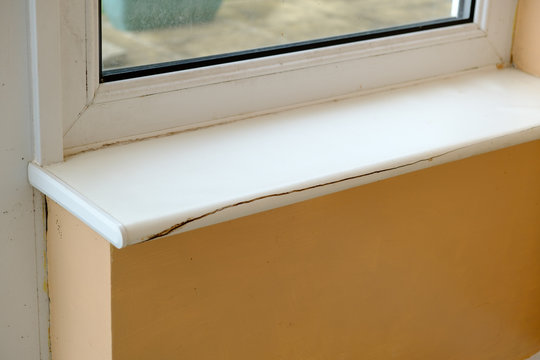 Empty room with broken window cill