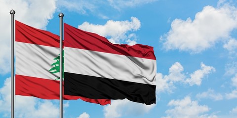 Lebanon and Yemen flag waving in the wind against white cloudy blue sky together. Diplomacy concept, international relations.