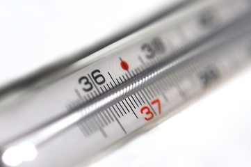 Close up of  vintage mercury thermometer isolated on white banckground