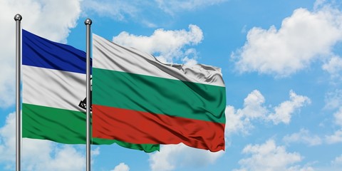 Lesotho and Bulgaria flag waving in the wind against white cloudy blue sky together. Diplomacy concept, international relations.