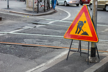 work in progress sign near tram rails in Milan, Lombardy, Italy