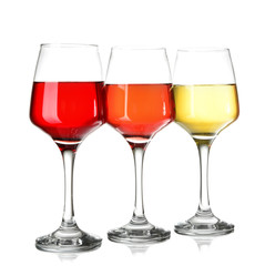 Glasses of different wine on white background