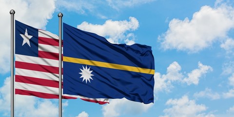 Liberia and Nauru flag waving in the wind against white cloudy blue sky together. Diplomacy concept, international relations.