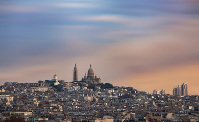 Panoramic view from the Arc de Triomphe, The Basilica of Sacred Heart at Montmartre. France. Famous touristic places in Europe. European city travel concept.