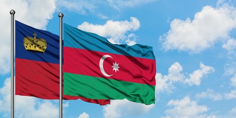 Liechtenstein and Azerbaijan flag waving in the wind against white cloudy blue sky together. Diplomacy concept, international relations.