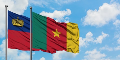 Liechtenstein and Cameroon flag waving in the wind against white cloudy blue sky together. Diplomacy concept, international relations.