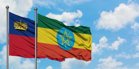 Liechtenstein and Ethiopia flag waving in the wind against white cloudy blue sky together. Diplomacy concept, international relations.