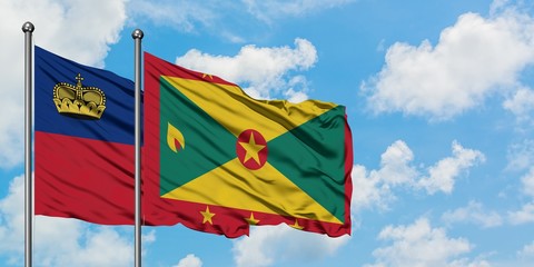 Liechtenstein and Grenada flag waving in the wind against white cloudy blue sky together. Diplomacy concept, international relations.