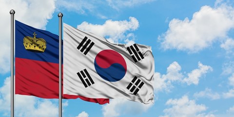 Liechtenstein and South Korea flag waving in the wind against white cloudy blue sky together. Diplomacy concept, international relations.
