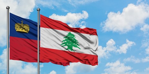 Liechtenstein and Lebanon flag waving in the wind against white cloudy blue sky together. Diplomacy concept, international relations.