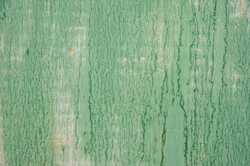Obraz premium Abstract background. Faded from time and weather painted in a light pastel green metal surface with cracks, streaks and rust. Background, structure