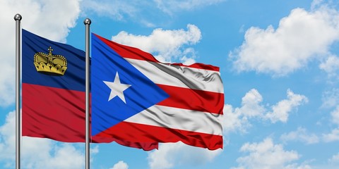 Liechtenstein and Puerto Rico flag waving in the wind against white cloudy blue sky together. Diplomacy concept, international relations.