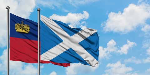 Liechtenstein and Scotland flag waving in the wind against white cloudy blue sky together. Diplomacy concept, international relations.