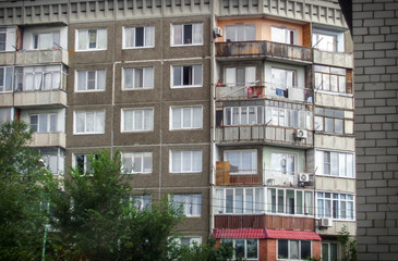 Fototapeta premium Soviet architecture. Apartment building. Soviet architectural style. Typical socialist apartment building. Apartment block. Architectural background. Ust-Kamenogorsk (Kazakhstan)