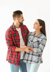 Portrait of happy young couple on white background