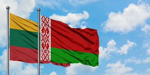 Lithuania and Belarus flag waving in the wind against white cloudy blue sky together. Diplomacy concept, international relations.