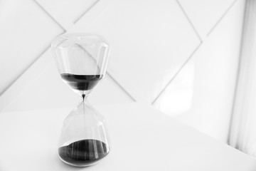 Hourglass on table in room