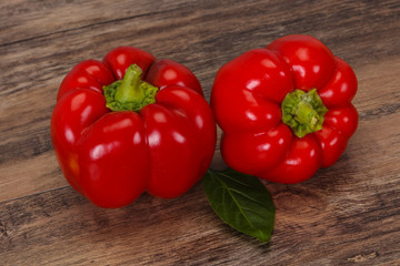 Ripe Red bell pepper over wooden