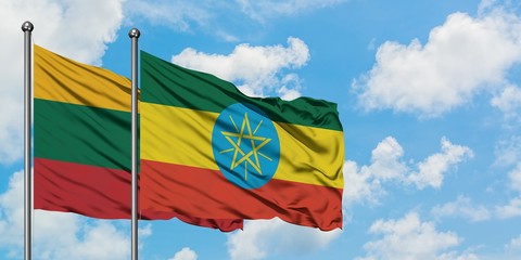 Lithuania and Ethiopia flag waving in the wind against white cloudy blue sky together. Diplomacy concept, international relations.