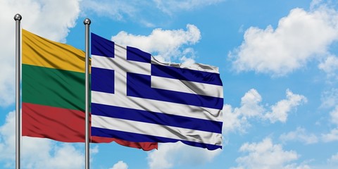 Lithuania and Greece flag waving in the wind against white cloudy blue sky together. Diplomacy concept, international relations.