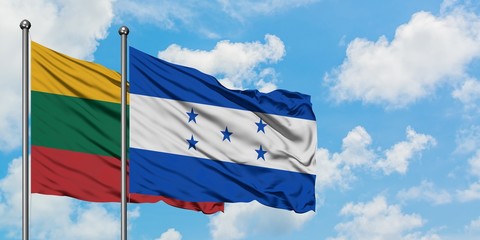 Lithuania and Honduras flag waving in the wind against white cloudy blue sky together. Diplomacy concept, international relations.