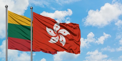 Lithuania and Hong Kong flag waving in the wind against white cloudy blue sky together. Diplomacy concept, international relations.