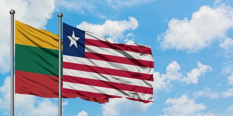 Lithuania and Liberia flag waving in the wind against white cloudy blue sky together. Diplomacy concept, international relations.