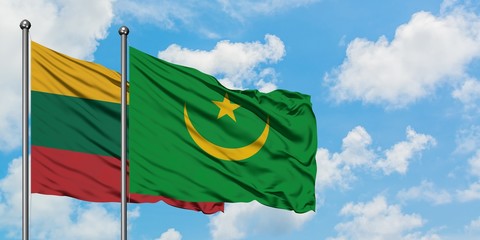 Lithuania and Mauritania flag waving in the wind against white cloudy blue sky together. Diplomacy concept, international relations.