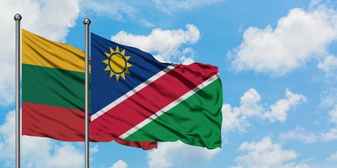 Lithuania and Namibia flag waving in the wind against white cloudy blue sky together. Diplomacy concept, international relations.