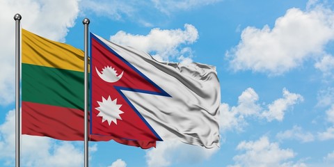 Lithuania and Nepal flag waving in the wind against white cloudy blue sky together. Diplomacy concept, international relations.