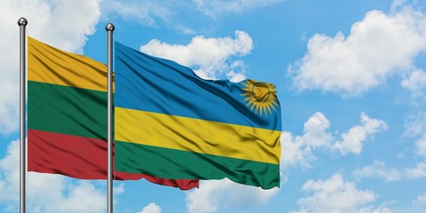 Lithuania and Rwanda flag waving in the wind against white cloudy blue sky together. Diplomacy concept, international relations.