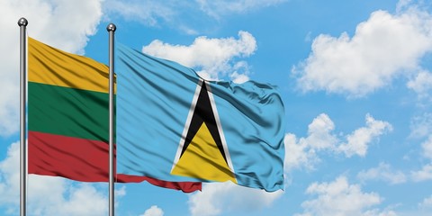 Lithuania and Saint Lucia flag waving in the wind against white cloudy blue sky together. Diplomacy concept, international relations.