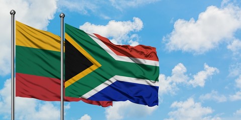 Lithuania and South Africa flag waving in the wind against white cloudy blue sky together. Diplomacy concept, international relations.