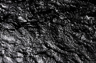 Background of black oil pollution texture pattern.