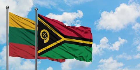 Lithuania and Vanuatu flag waving in the wind against white cloudy blue sky together. Diplomacy concept, international relations.