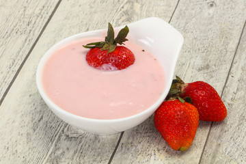 Yoghurt with strawberry in the bowl