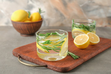 Glasses of fresh lemonade on table