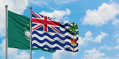 Macao and British Indian Ocean Territory flag waving in the wind against white cloudy blue sky together. Diplomacy concept, international relations.