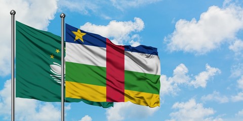 Macao and Central African Republic flag waving in the wind against white cloudy blue sky together. Diplomacy concept, international relations.