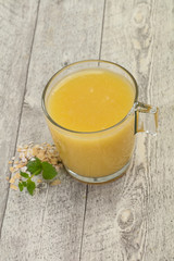 Dietary vegetarian oats milk over wooden