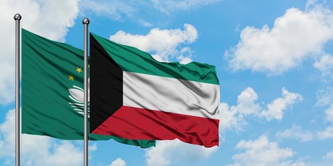 Macao and Kuwait flag waving in the wind against white cloudy blue sky together. Diplomacy concept,...