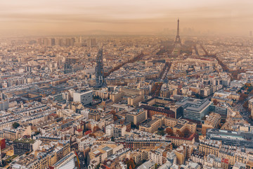 Naklejka premium Aerial panorama of Paris City in late autumn from Maine-Montparnasse Tower at sunset.