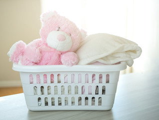 Fototapeta na wymiar Plastic basket with clean clothes.